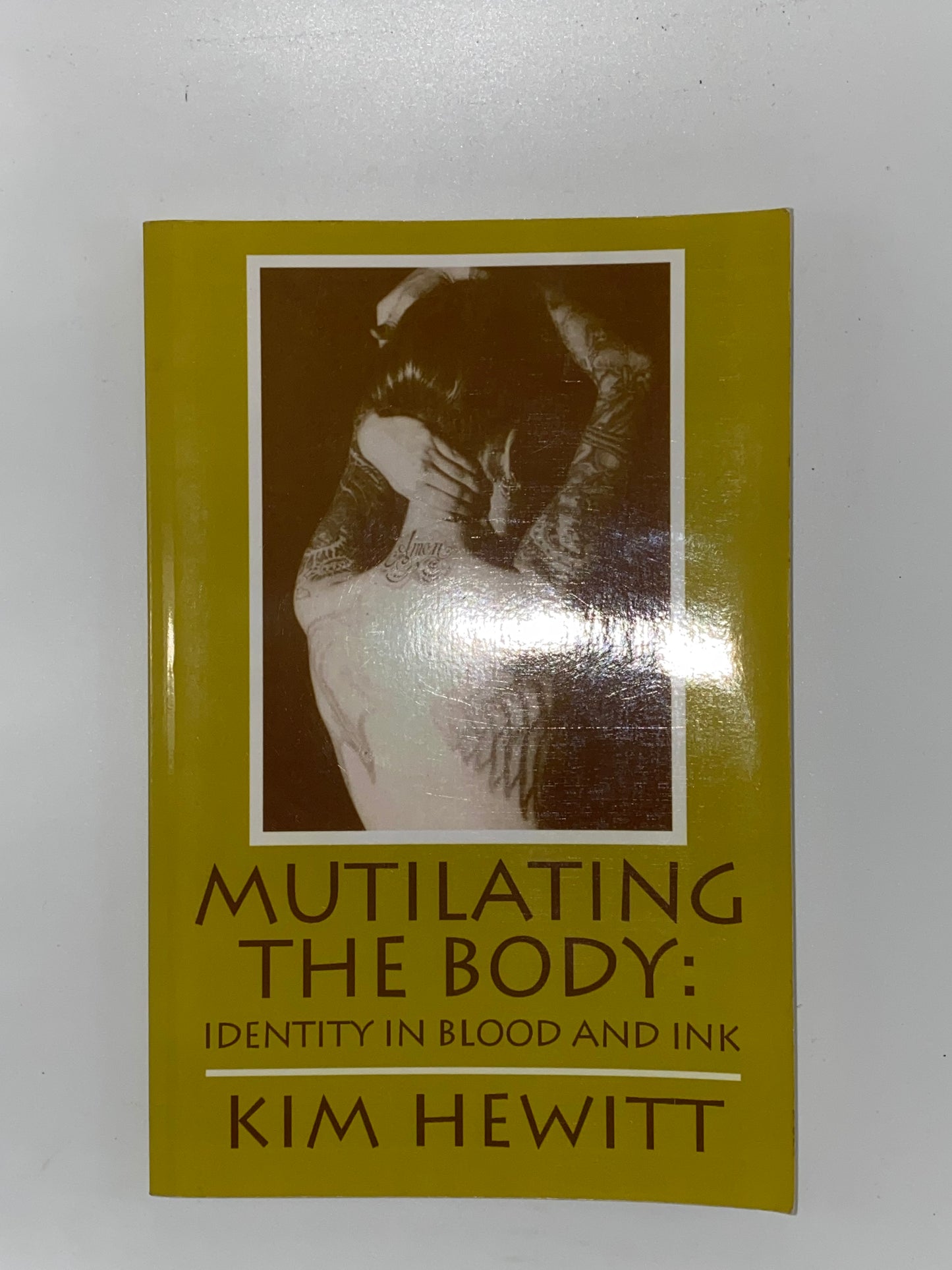 Mutilating the Body: Identity in Blood and Ink